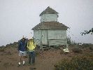 Mark and Kerie at the cupola atop Black Butte. What is that duck doing above Mark's hat?.